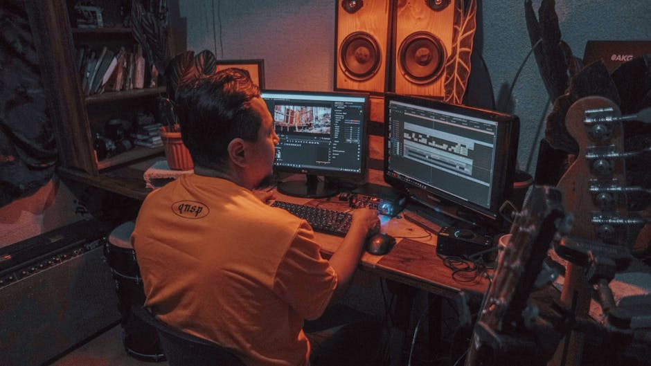 Video editing studio with multiple monitors showing color grading