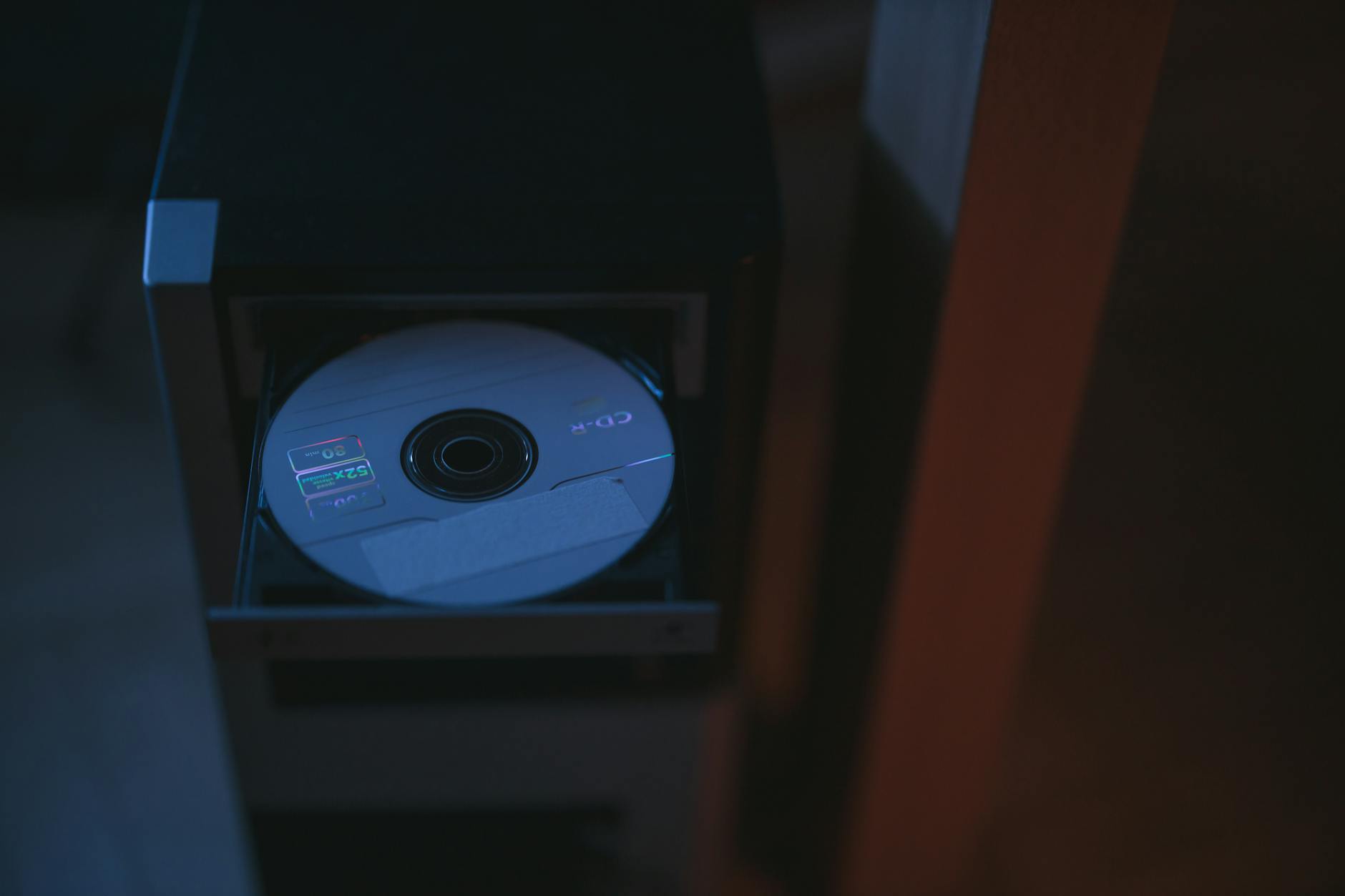 Old Windows Media Player interface next to modern music apps showing WMA compatibility issue