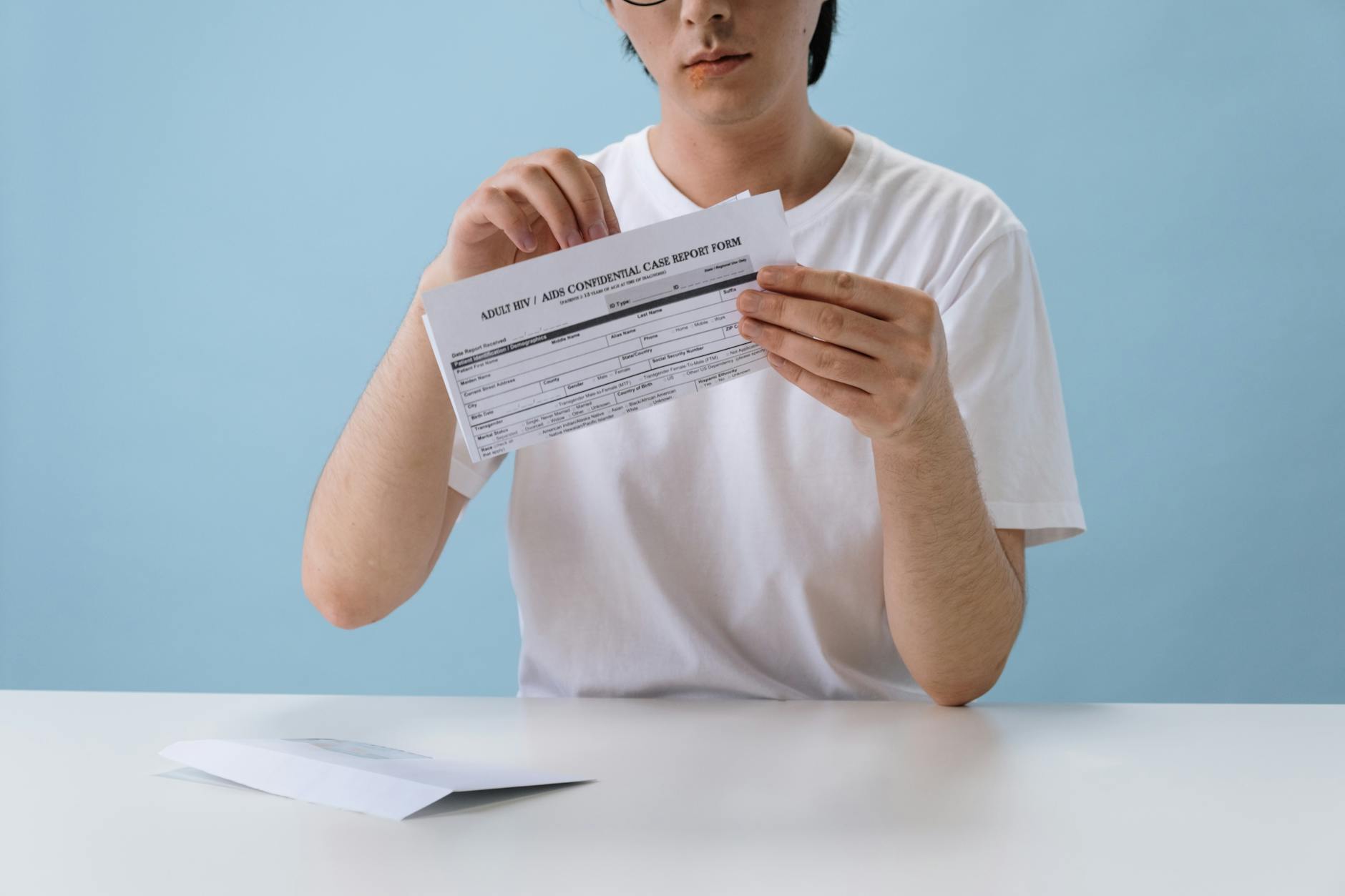 Different types of sensitive information being redacted in a document: SSN, address, financial data